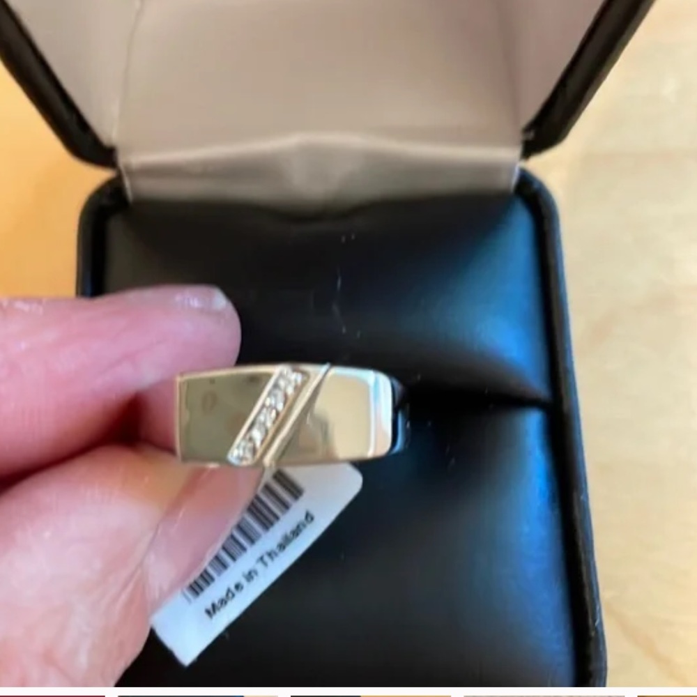 NWT men’s silver ring with diamonds with certificate of authenticity.